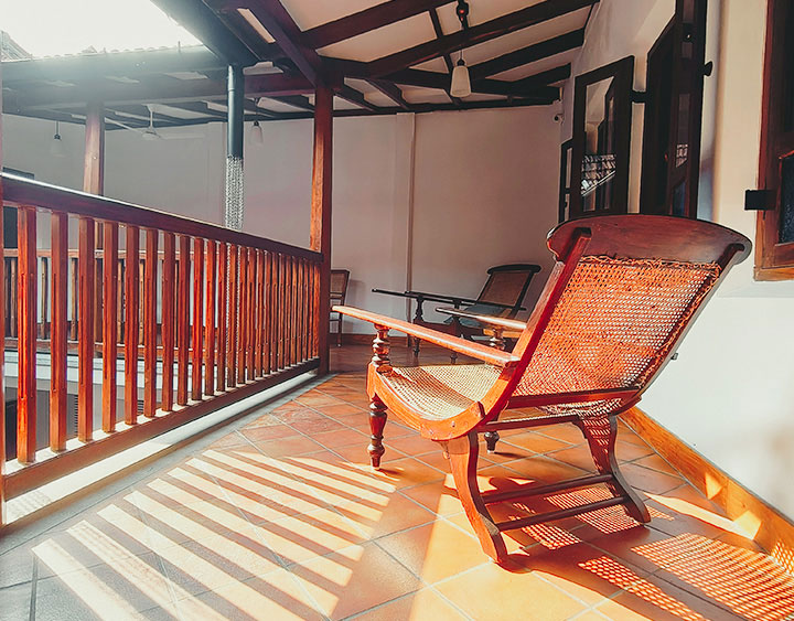 balcony-with-chair-image Heritage staircase at Ezekiel House